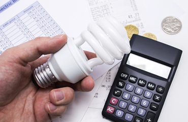 light bulb whit calculator and euro coins